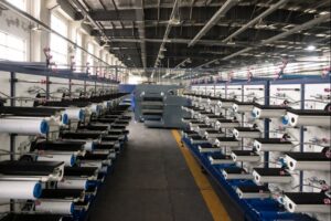 Industrial yarn winding line using membrane-split PTFE sewing thread in real production