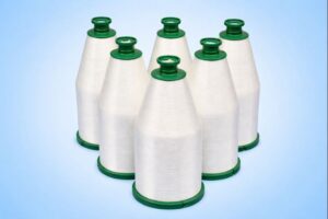 Fiberglass yarn wound on industrial spools for high-temperature filtration applications